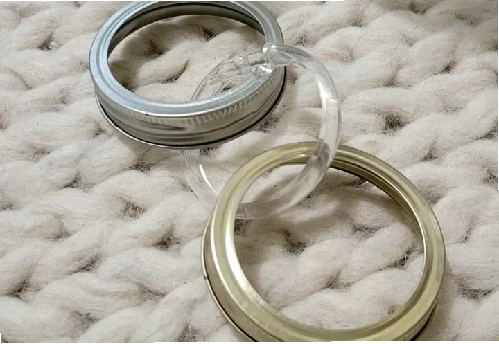 Metal mason jar lid rims used as a rabbit toss toy